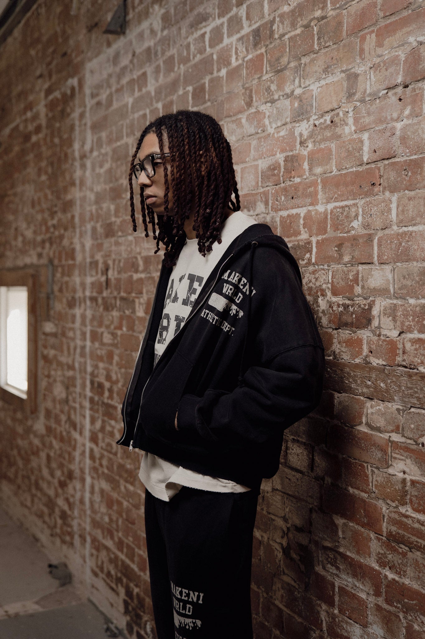 black sunfade athletic department zip up